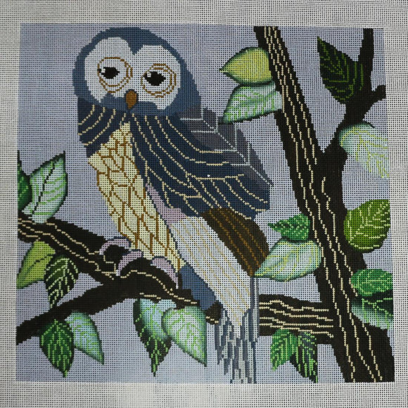 Blue/Cream Owl in Tree